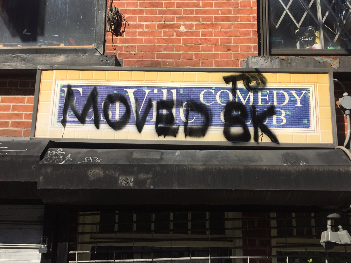 The Eastville Sign from their manhattan location graffiti'd over with "Moved to Brooklyn"